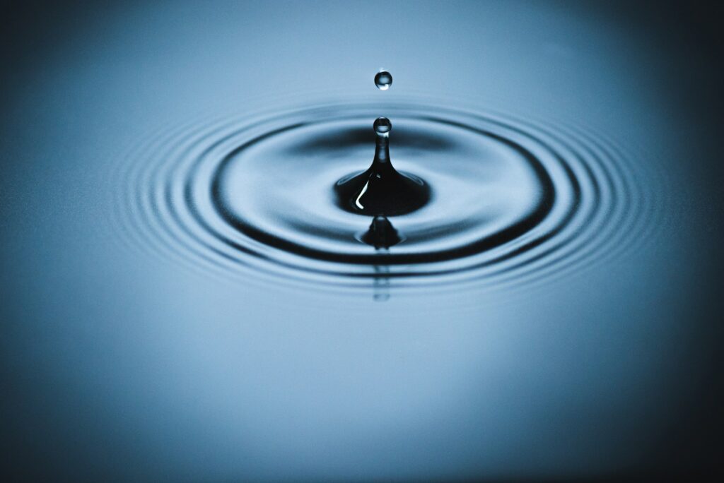 Splash of water drop on water surface